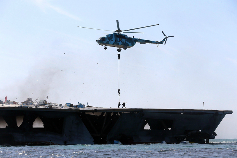Illustration for article titled Iran Blows Up Gigantic U.S. Carrier Mock-Up During Naval Exercise
